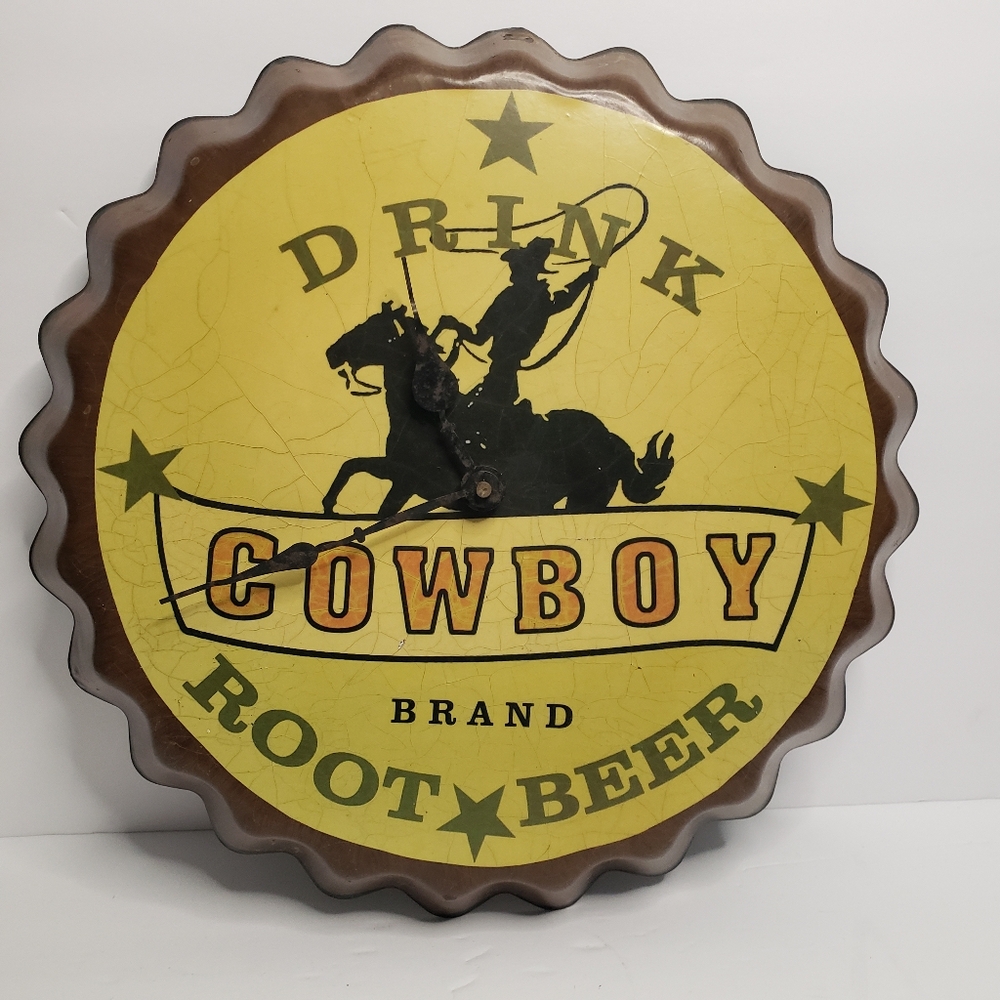 Metal Cowboy clock shaped like bottle cap. 191